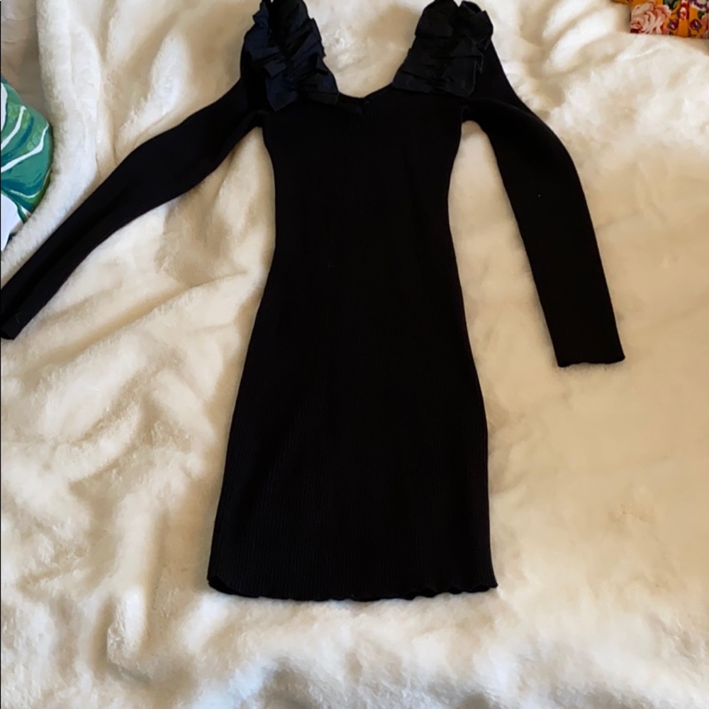 Bodycon black dress with ruffle details